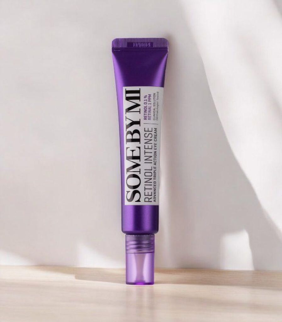 A tube of SOME BY MI Retinol Intense Advanced Triple Action Eye Cream is shown against a light gray and white background with shadows.