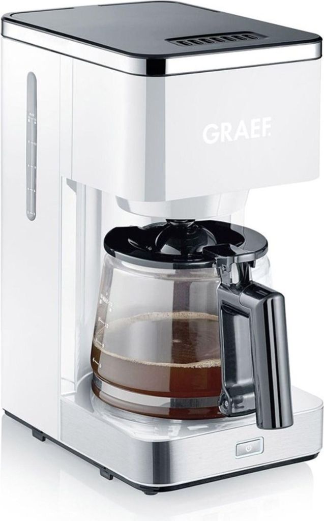 A white and silver coffee maker with a glass carafe filled with coffee, set against a white background.