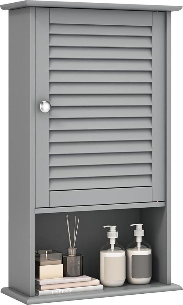 A gray bathroom wall cabinet with a louvered door and an open shelf below, displaying toiletries and decorative items.