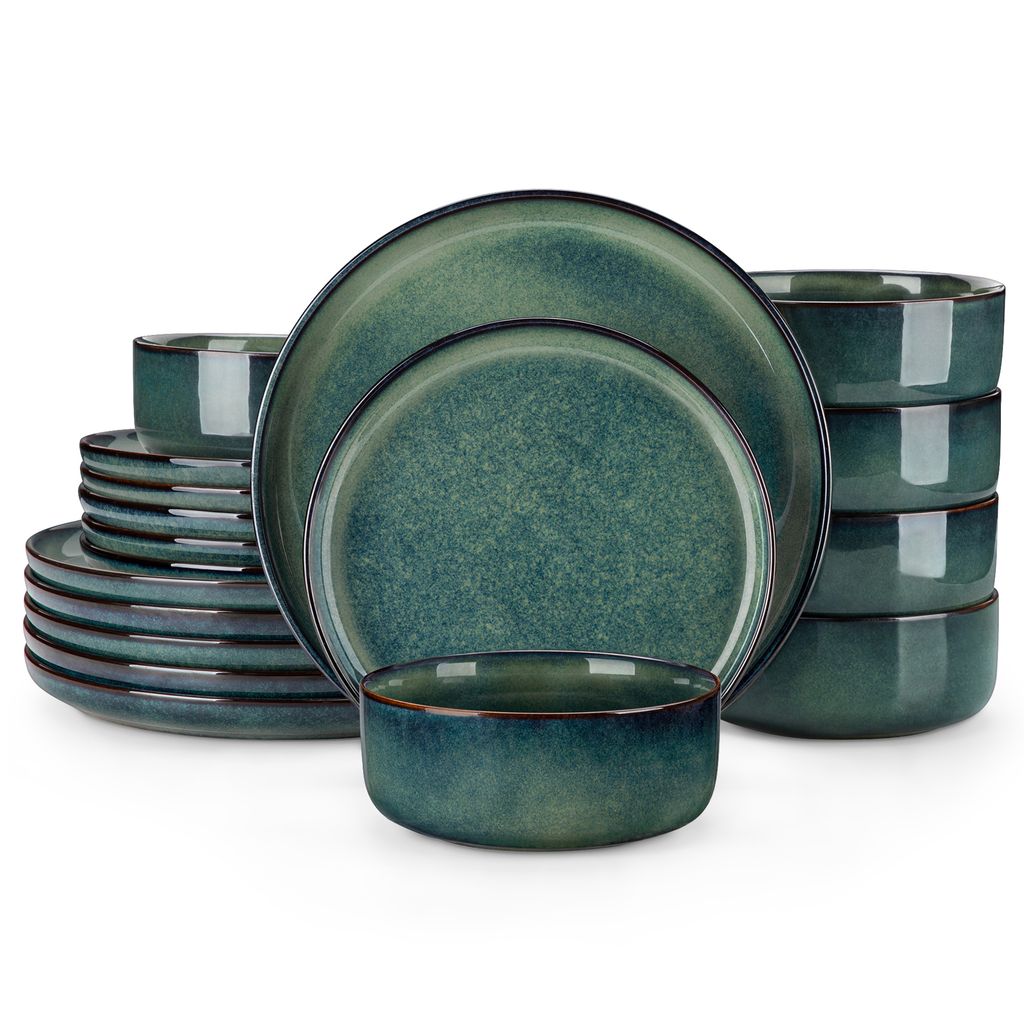 A set of green ceramic dishes, including plates and bowls, stacked and arranged on a white background.