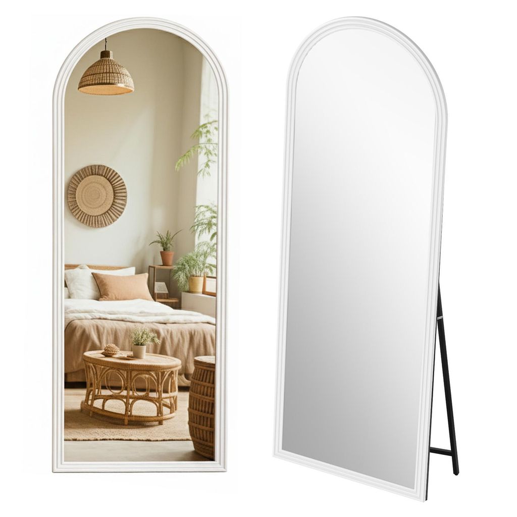 A full-length mirror with an arched top, shown in two views: one reflecting a bedroom scene and the other showing the mirror itself with its stand.
