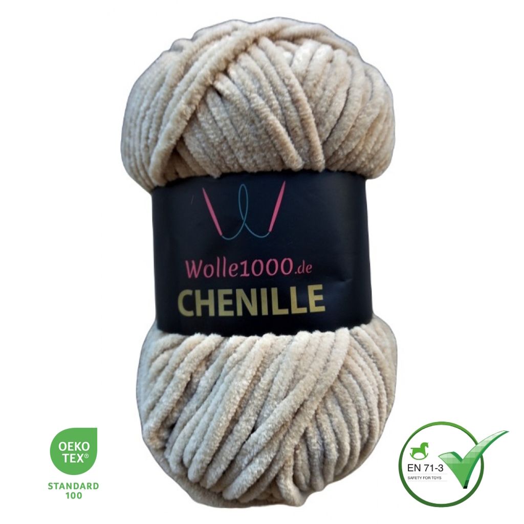 A ball of beige chenille yarn with a black label.