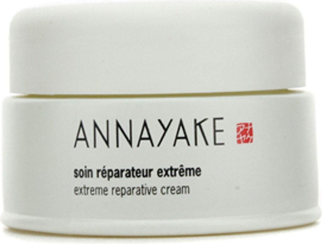A white jar of cream with text on it.