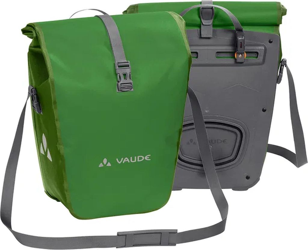 Two bicycle panniers, one green and one gray, are shown against a white background.