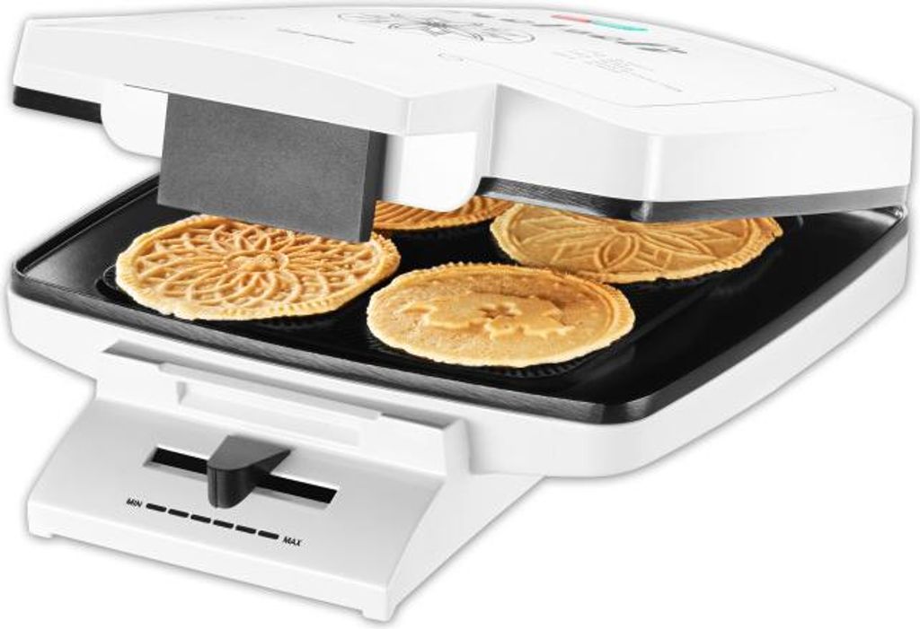 A close-up view of a waffle maker with several waffles inside.