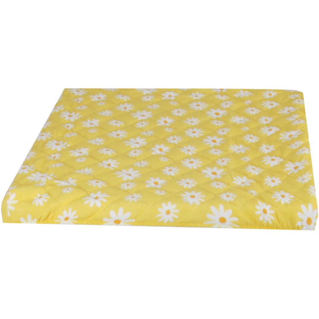 A yellow quilted cover with a daisy pattern, likely for a washing machine or dryer, is shown from a side angle against a white background.