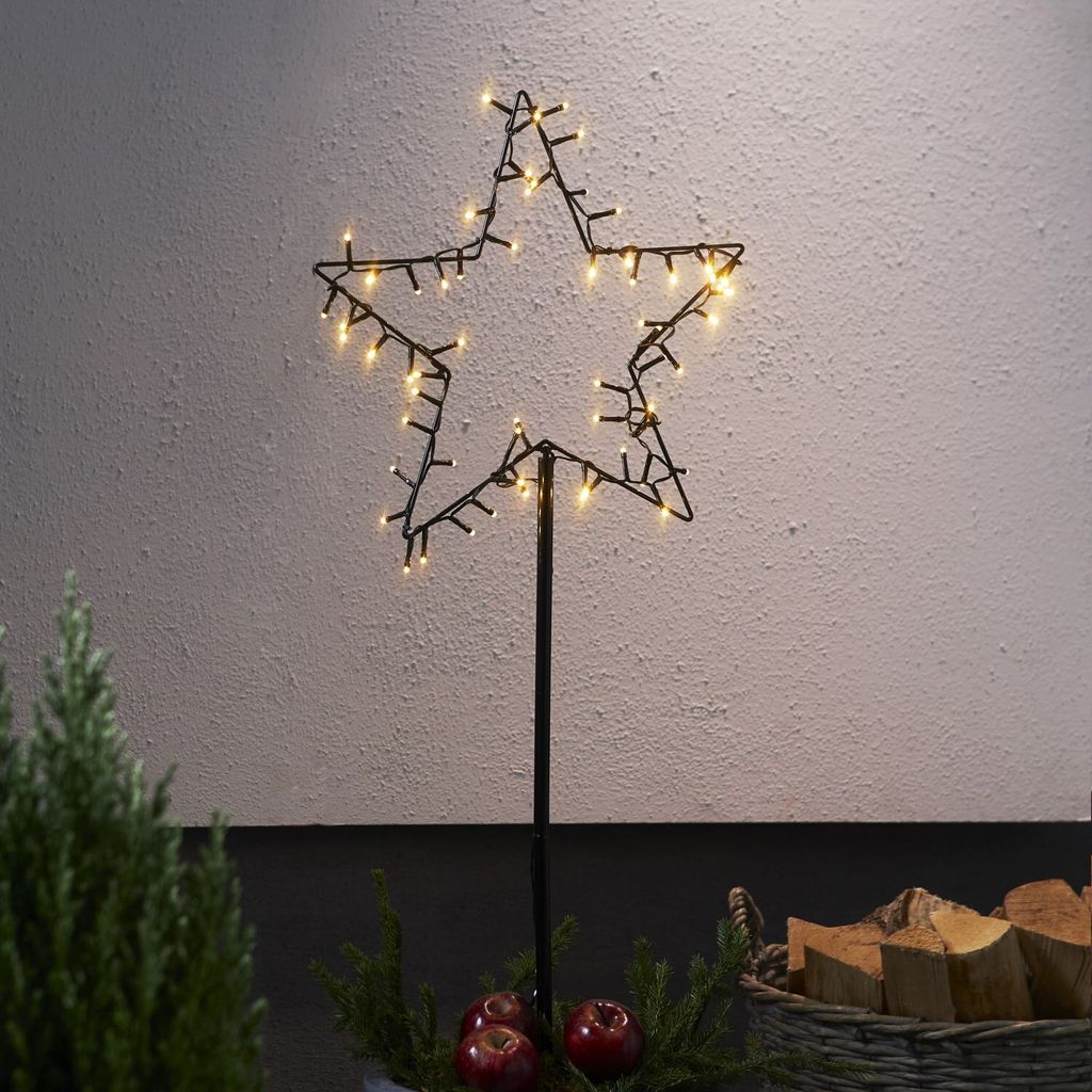A star-shaped garden stake with LED lights.