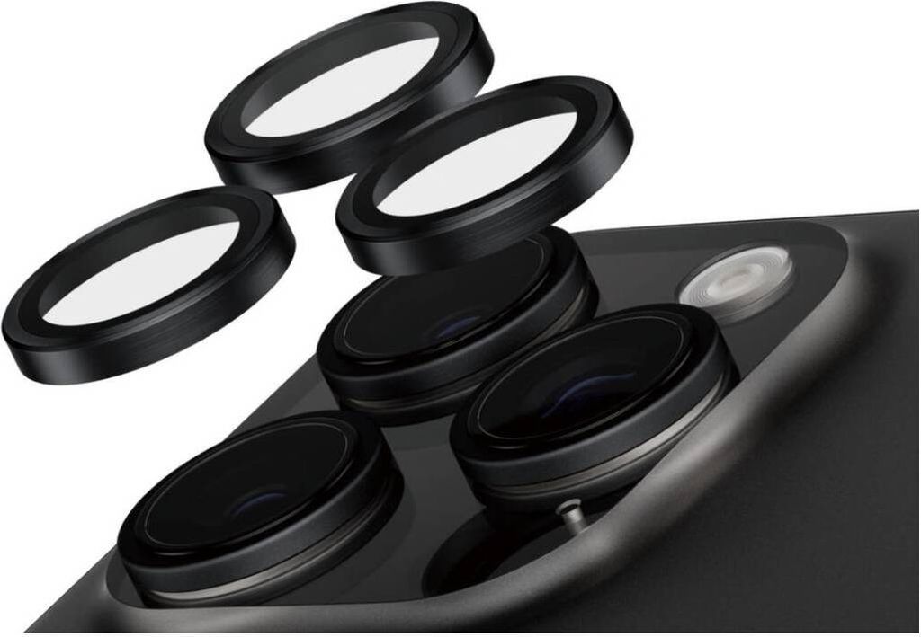 A close-up view of a smartphone camera module with several lens protectors arranged above it.