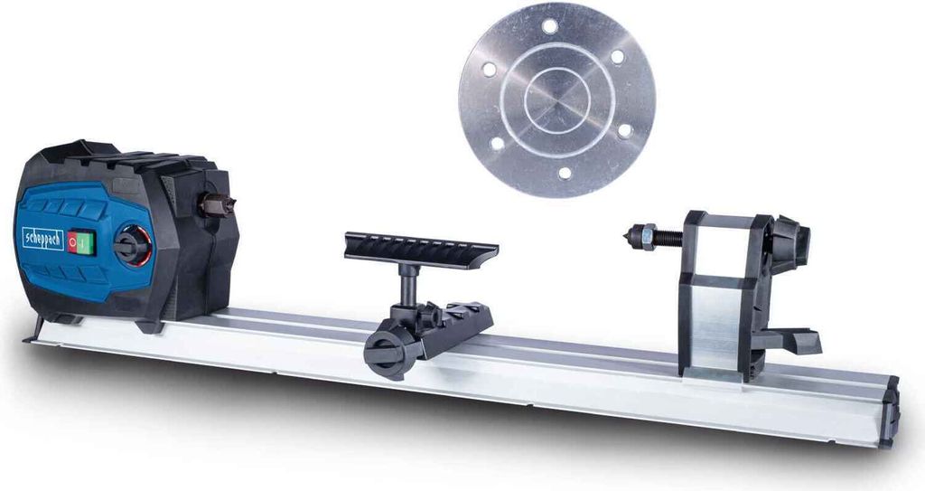 A woodworking lathe and a circular metal plate are displayed against a white background.