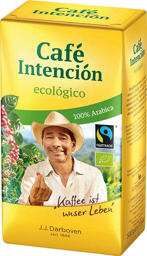 A yellow coffee packaging box with a man's face and coffee beans on it.