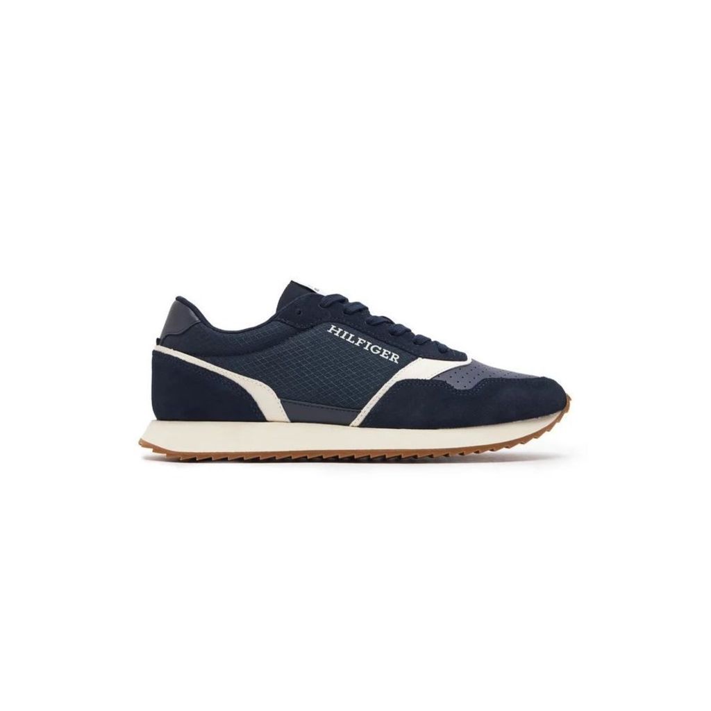 A single navy blue Tommy Hilfiger sneaker is shown against a white background.