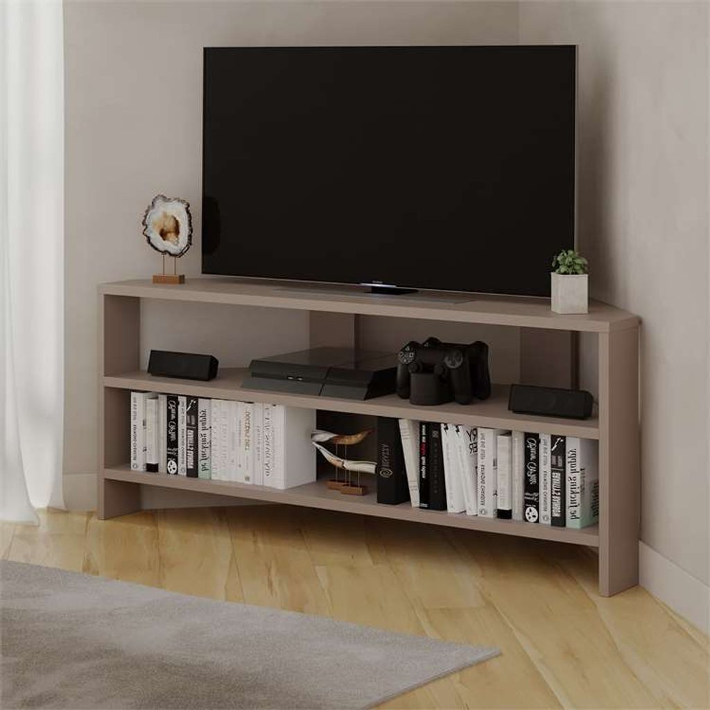 A corner TV stand with a TV, game console, and books.