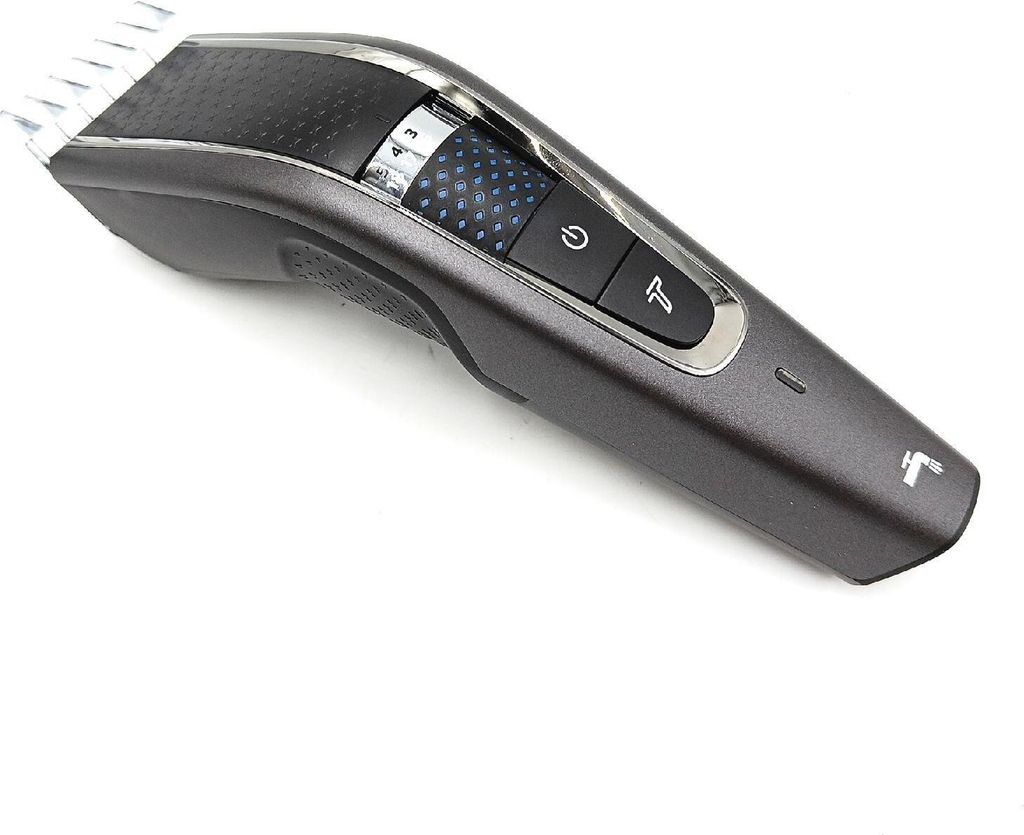 A close-up studio shot of a gray and black hair clipper against a white background.