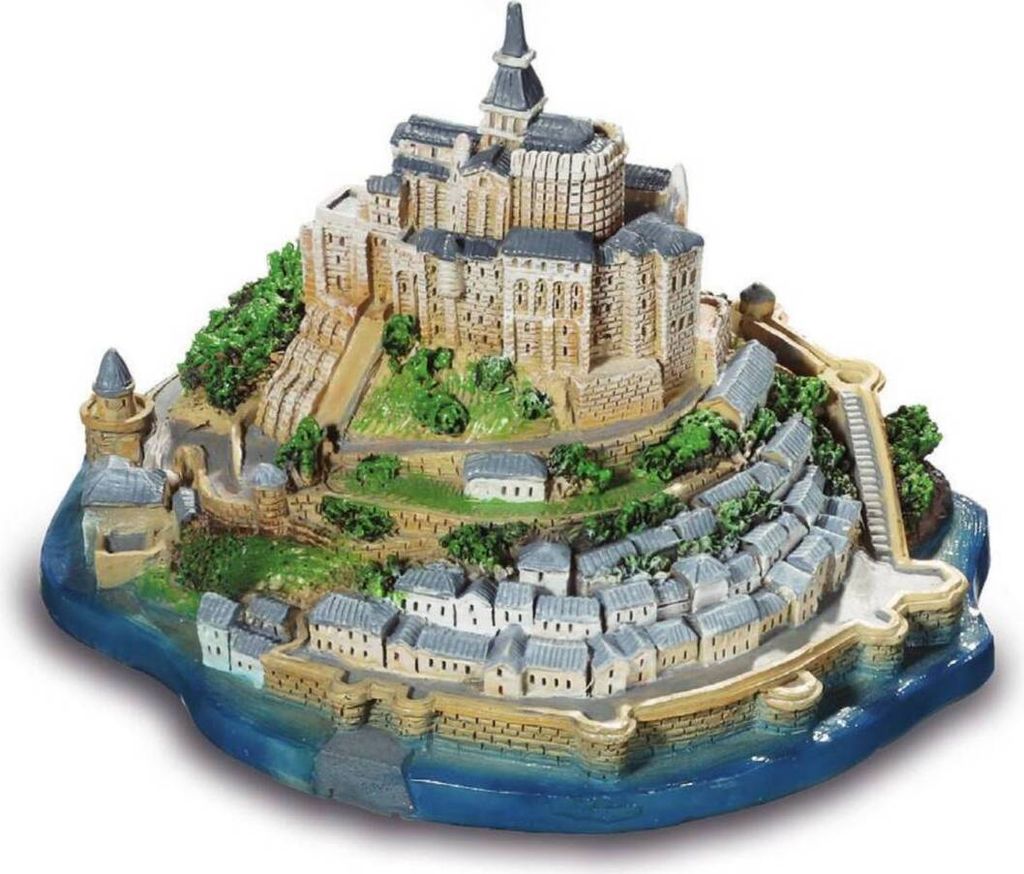 A miniature model of Mont-Saint-Michel, a French island commune, featuring the abbey and surrounding village.