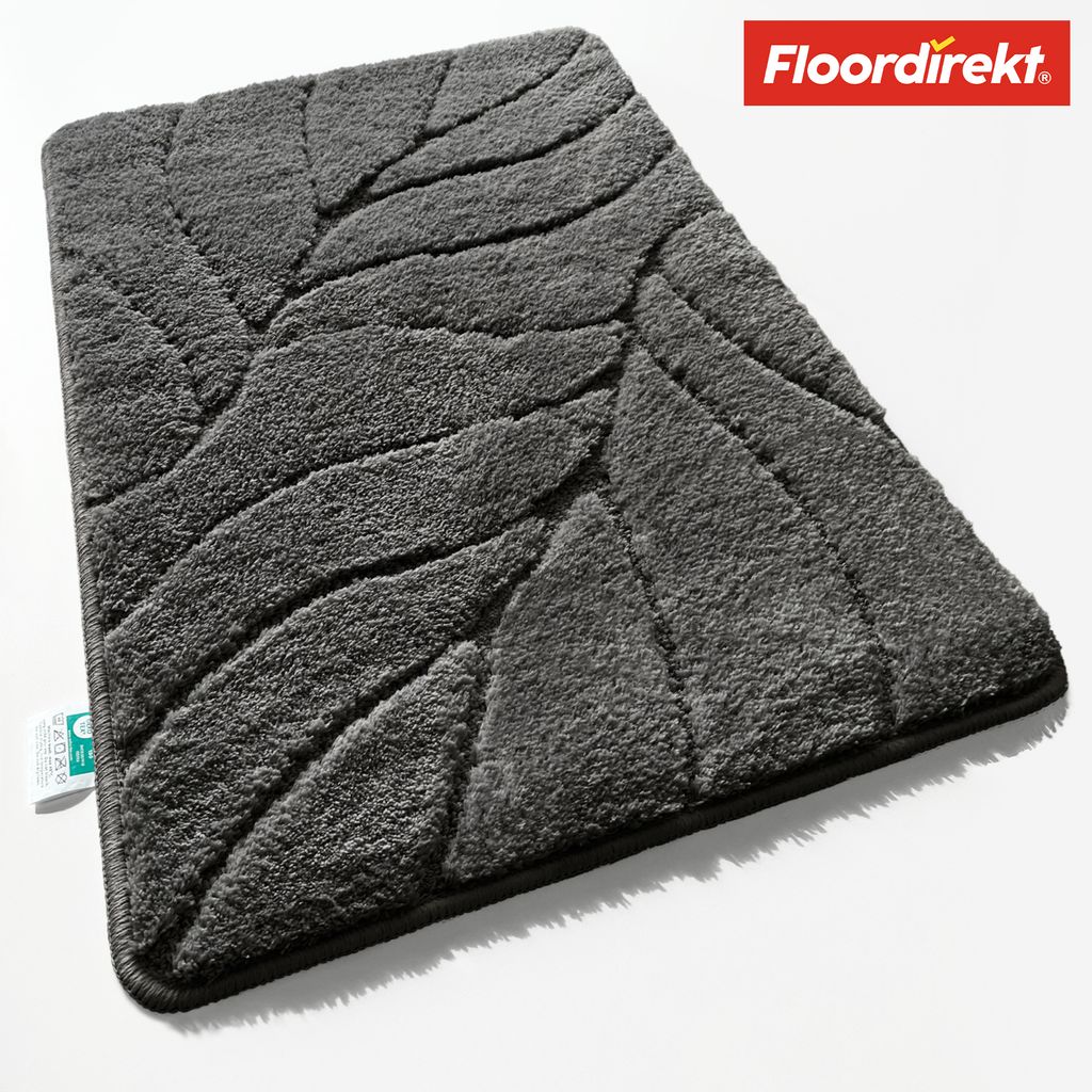 A dark gray bath mat with a leaf pattern, shown from a slightly elevated angle on a white background.