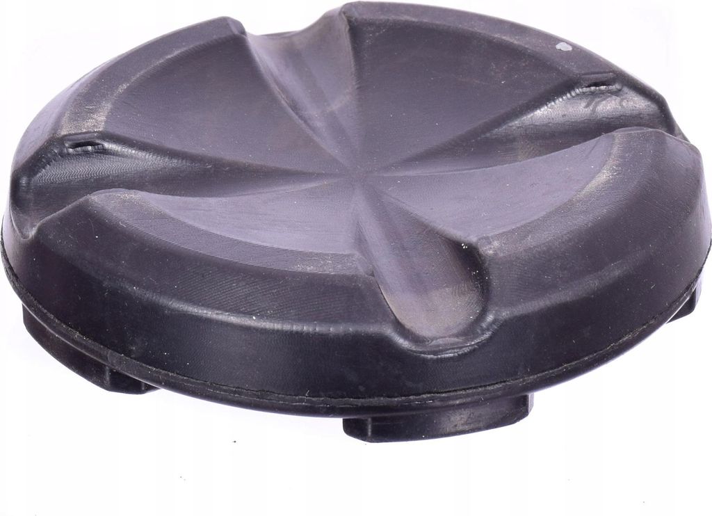 A black rubber jack pad with a star-shaped indentation on top, shown from a slightly elevated angle.