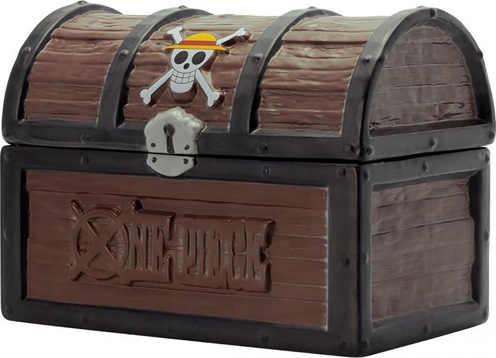 A close-up, front-facing view of a treasure chest-shaped cookie tin, designed to resemble aged wood with metal accents. It features the One Piece Jolly Roger logo on the lid and the series title embossed on the front.