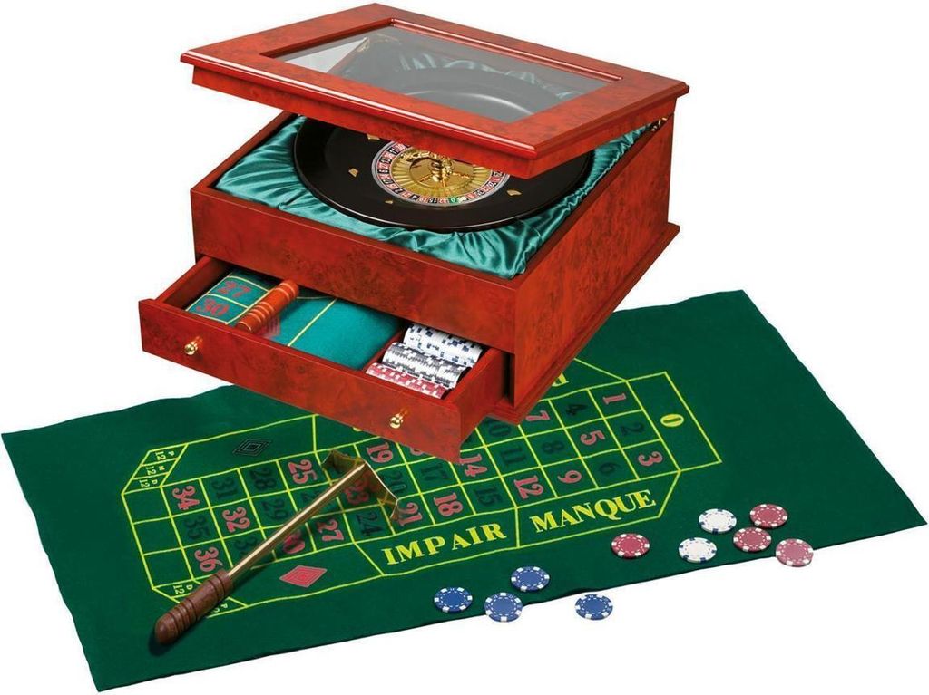 A roulette set displayed on a green felt mat with chips and a rake.