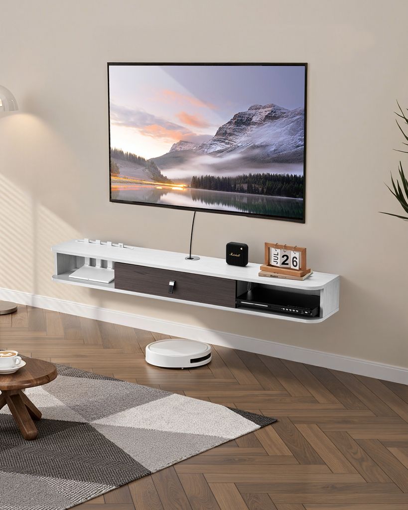 A modern living room with a wall-mounted TV stand and television.
