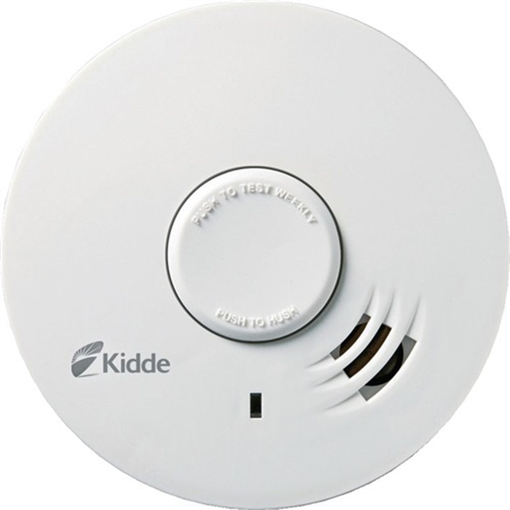 A white smoke detector is shown from a top-down perspective against a white background.