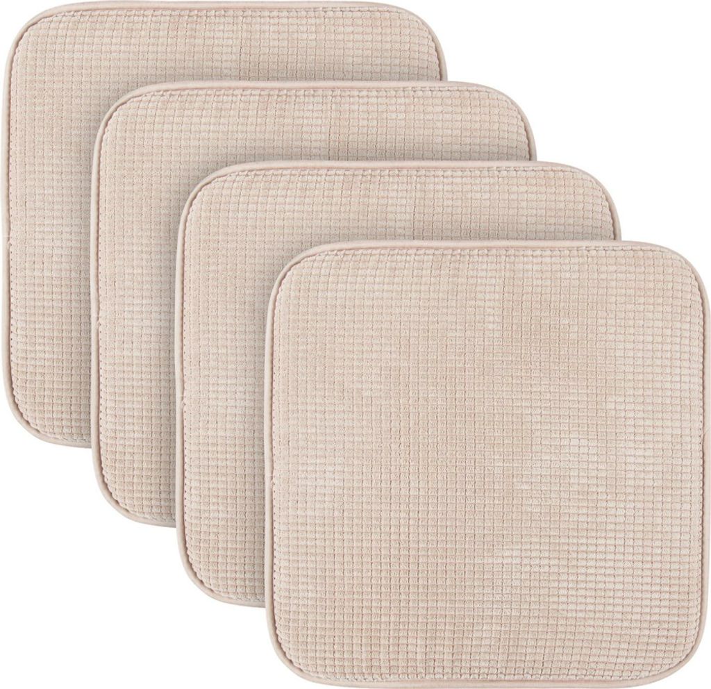Four beige seat cushions are arranged in a staggered formation against a white background.