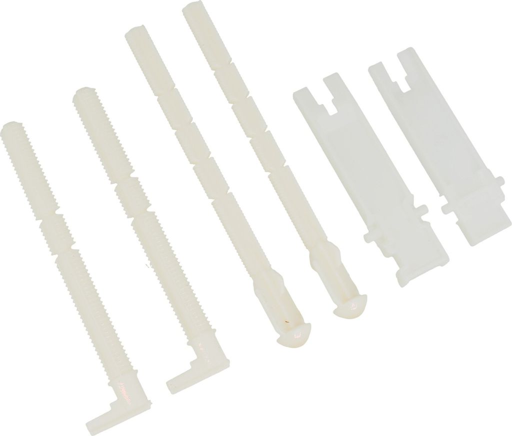 A collection of white plastic plumbing parts arranged diagonally on a white background.
