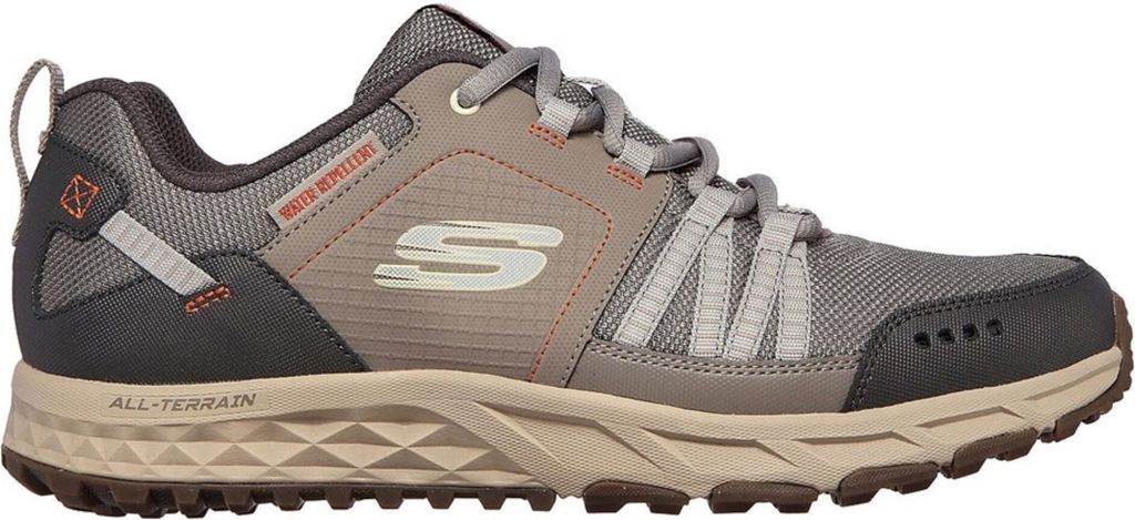 A side view of a single grey Skechers sneaker against a white background.