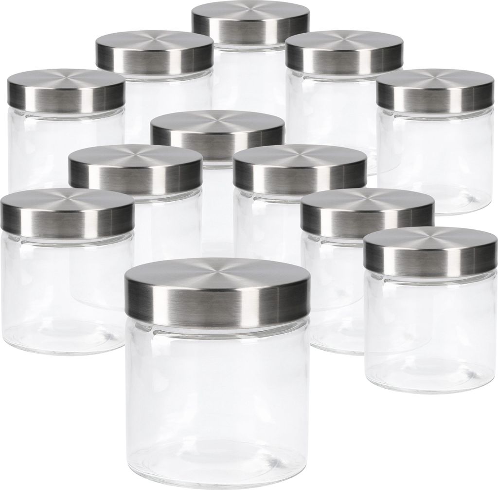 A collection of glass jars with stainless steel lids arranged on a white background.