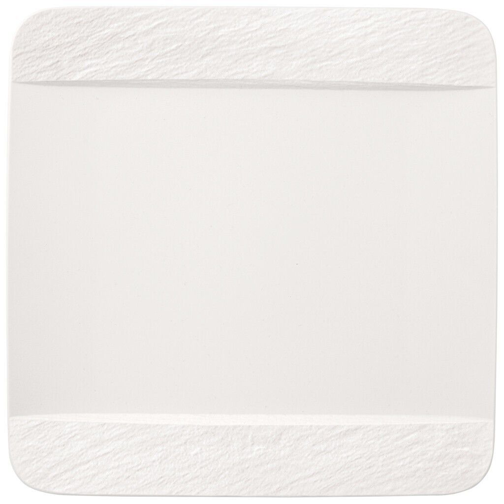 A white plate with textured edges on a white background.