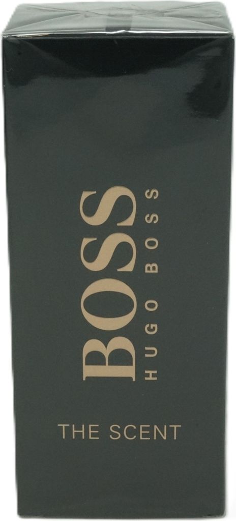 A close-up of a dark green box for Hugo Boss The Scent men's fragrance.