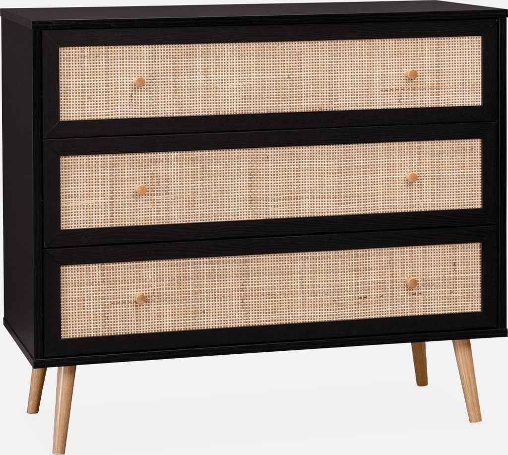 A chest of drawers with rattan fronts on a plain background.