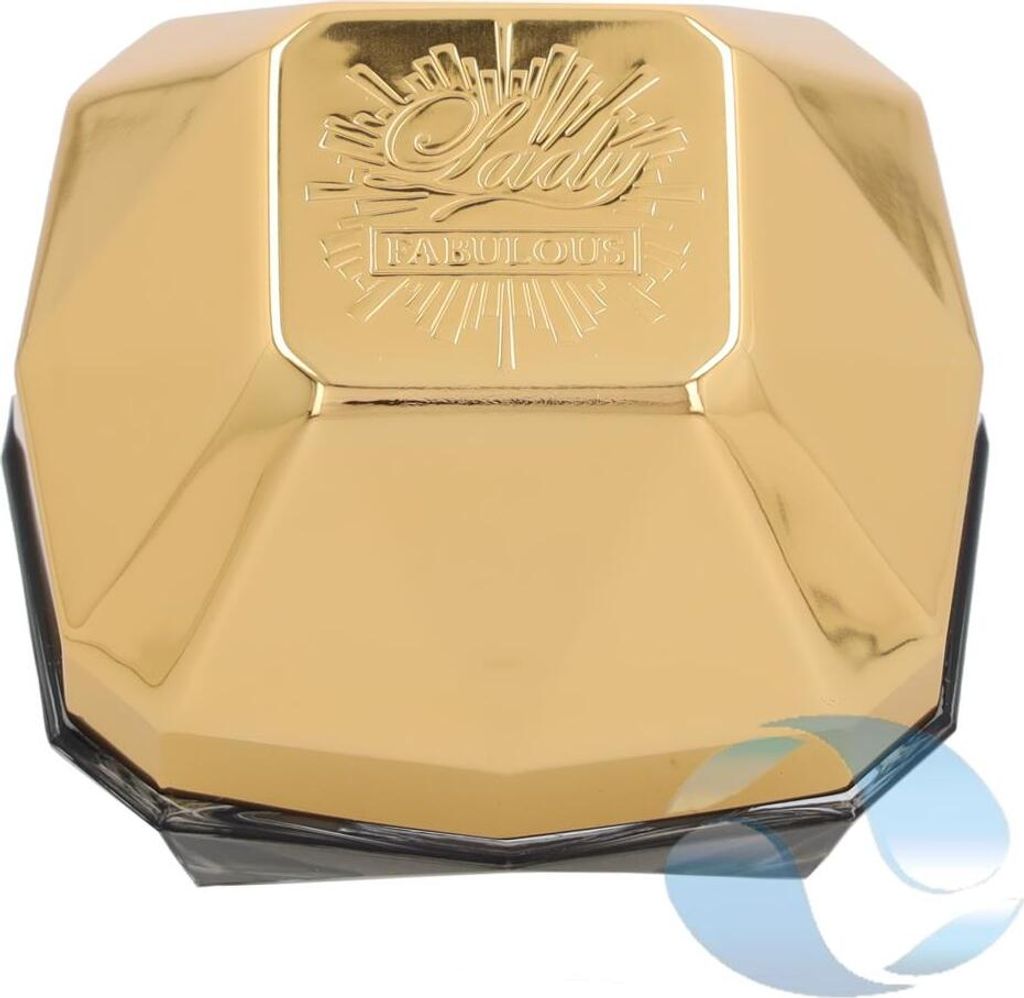 A close-up, top-down view of a gold-colored perfume bottle with faceted sides.