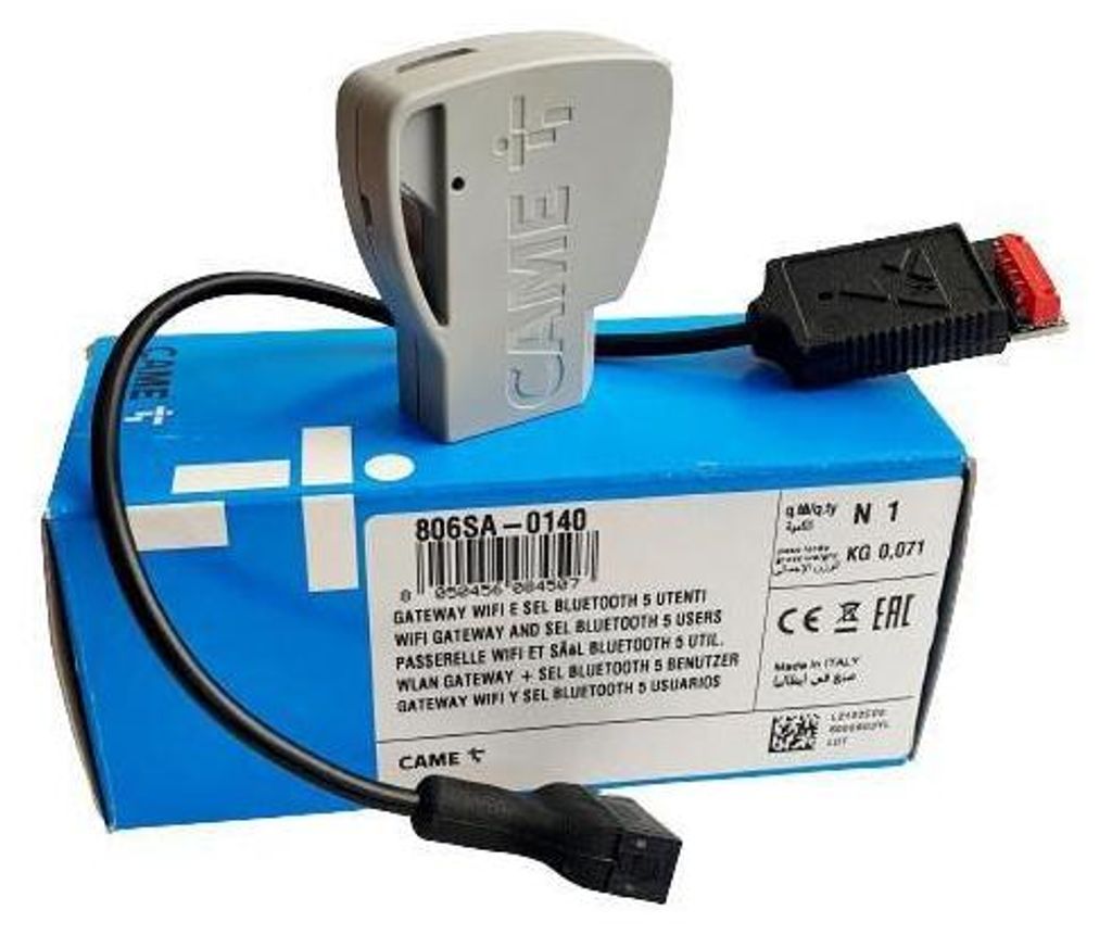A product box with a device and cables on top.