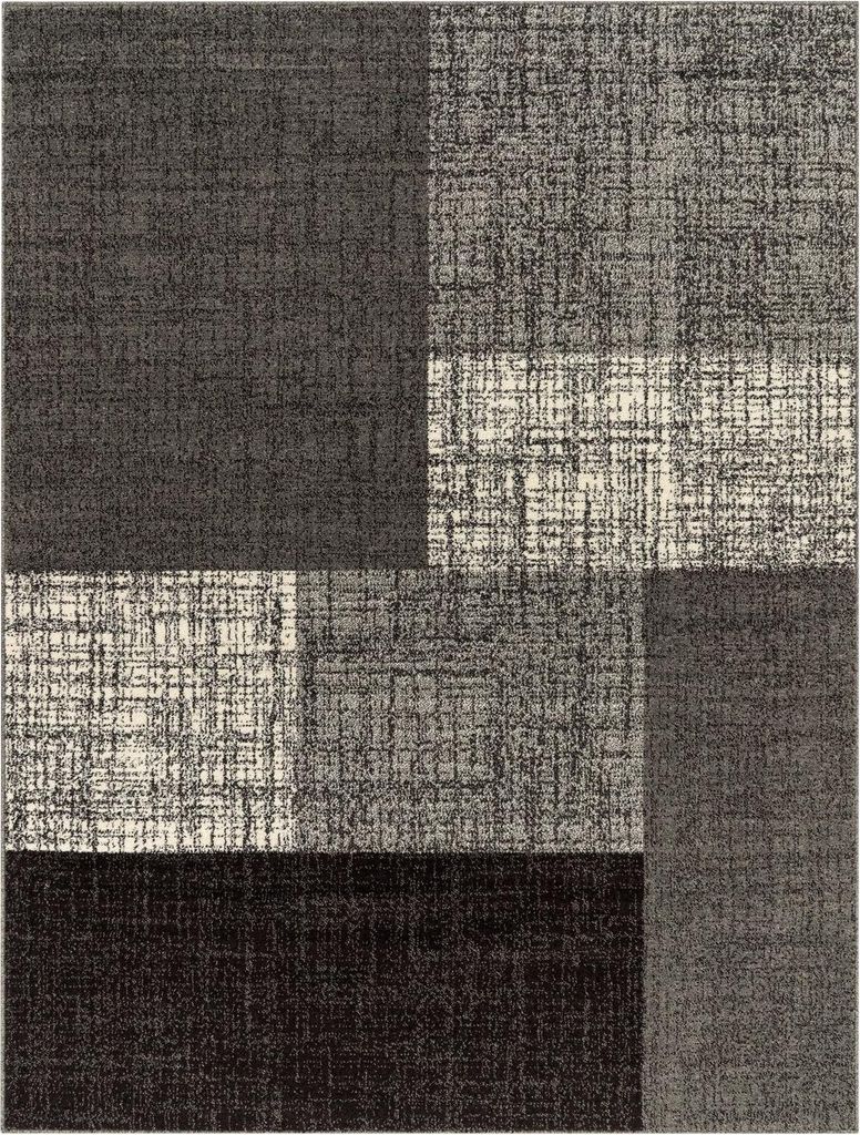 A close-up, top-down view of a rug with a geometric pattern.