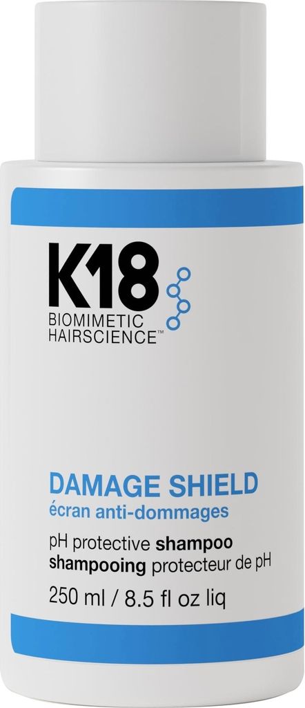 A white bottle of K18 Damage Shield pH Protective Shampoo.