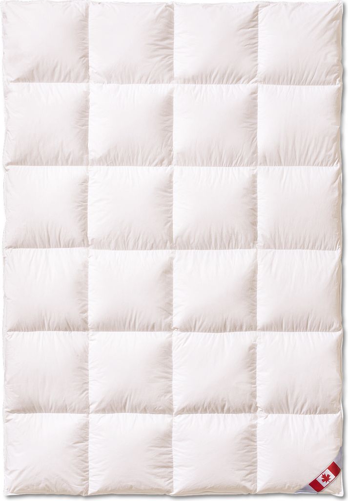 A white down comforter is laid flat, showing its quilted pattern.