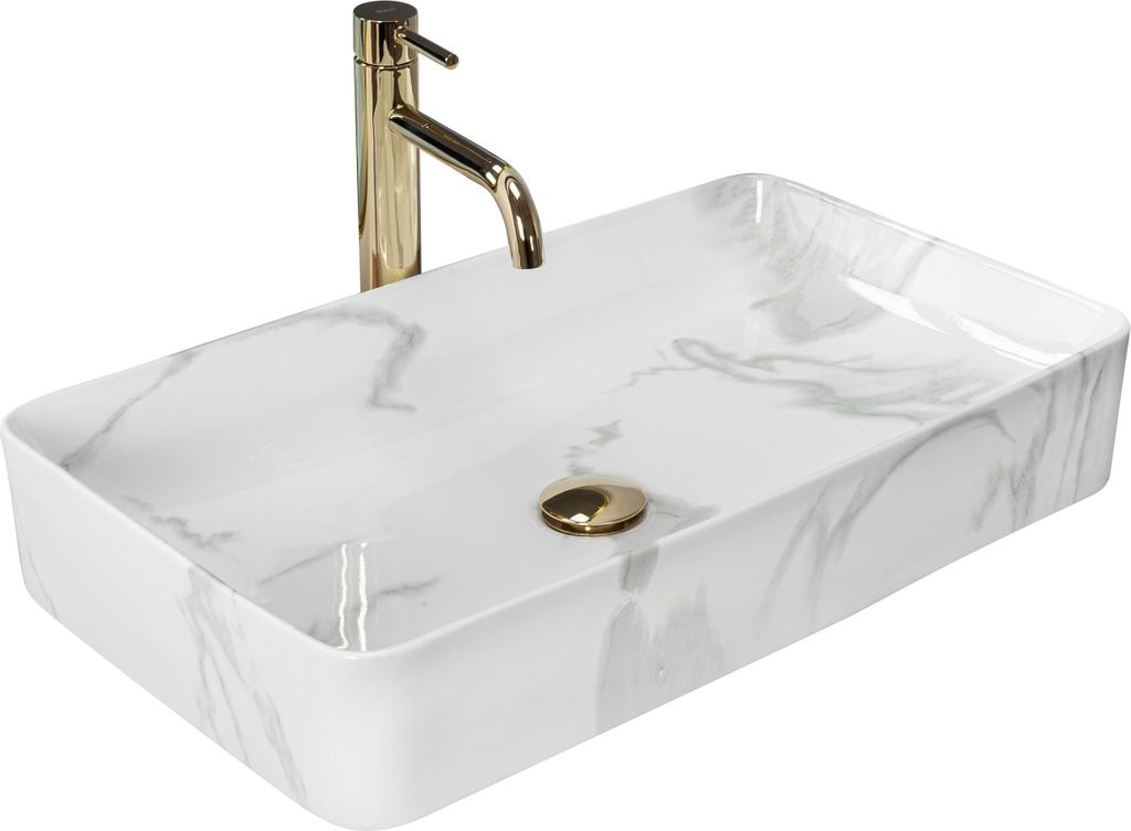 A rectangular white basin with a marble-like pattern and a gold faucet.