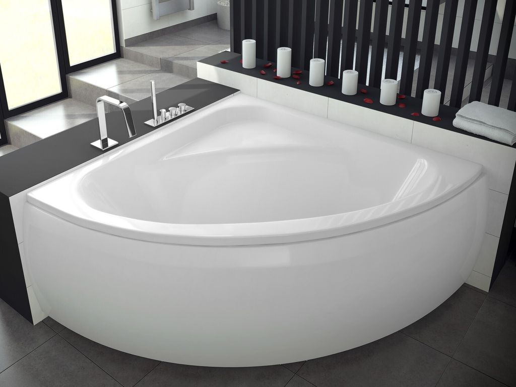 A modern corner bathtub in a bathroom setting.