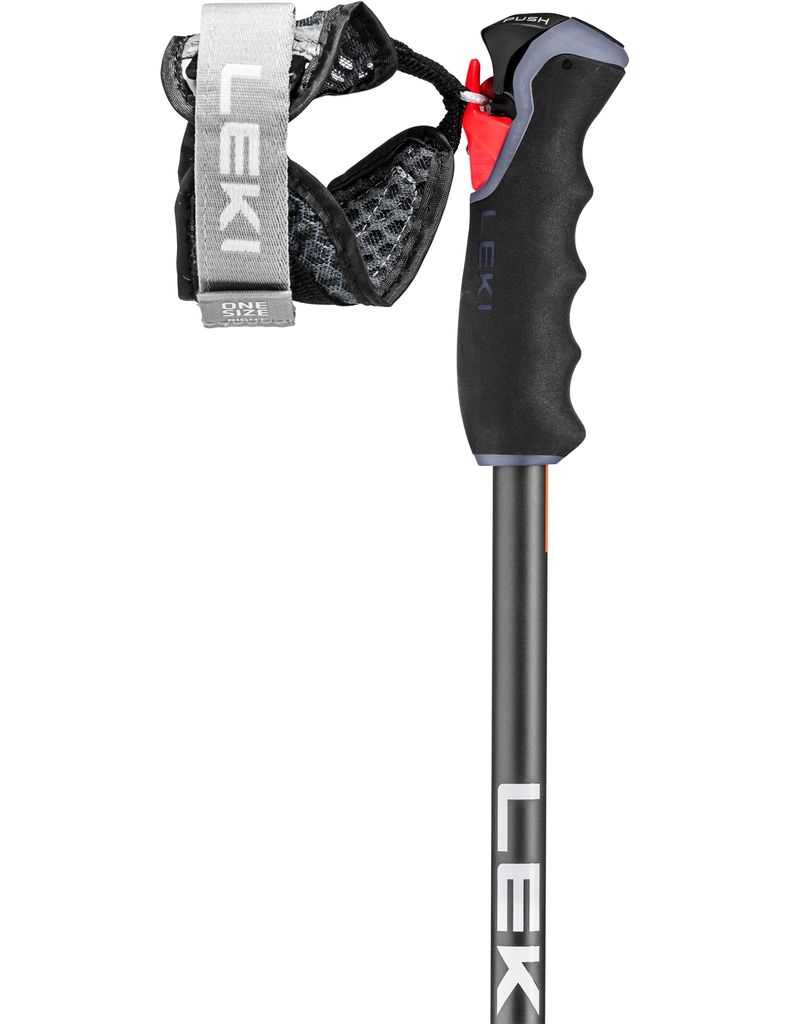 A close-up of a ski pole handle and strap.