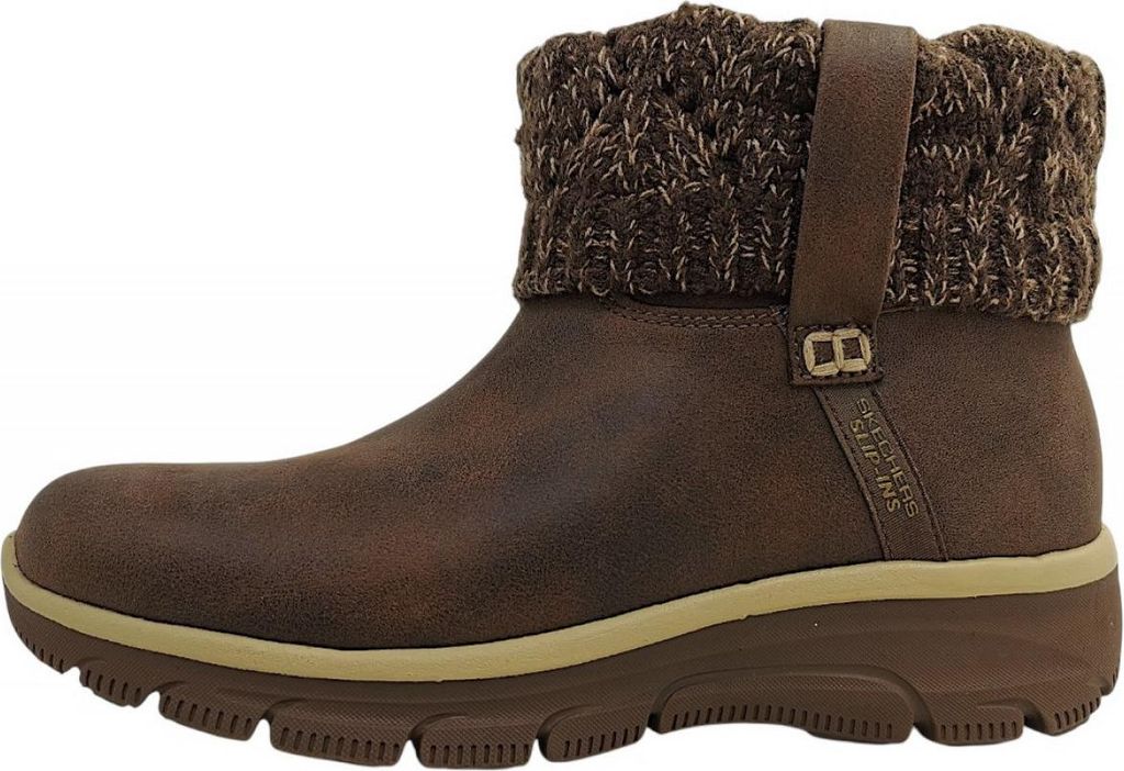 A side view of a brown boot with a knitted cuff.