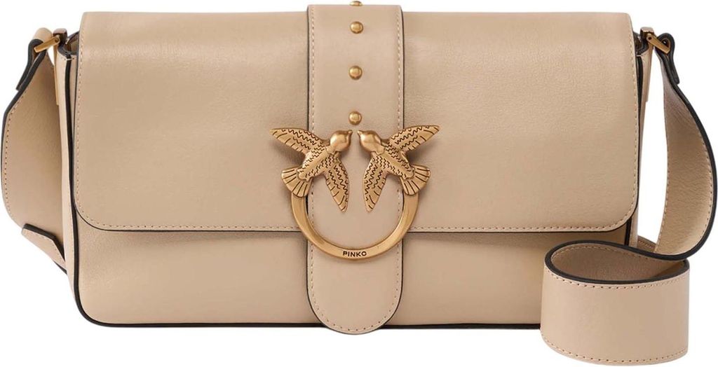 A beige leather handbag with gold hardware.