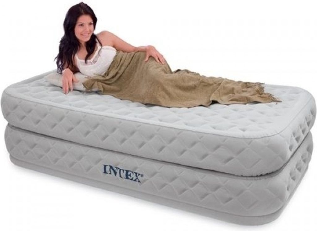 A woman lying on an inflatable mattress.