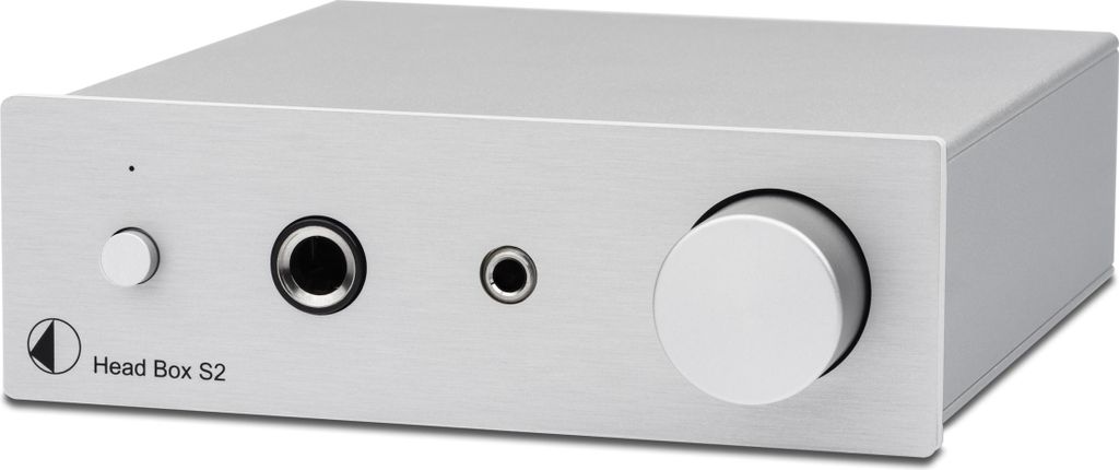 A silver headphone amplifier on a light gray background.