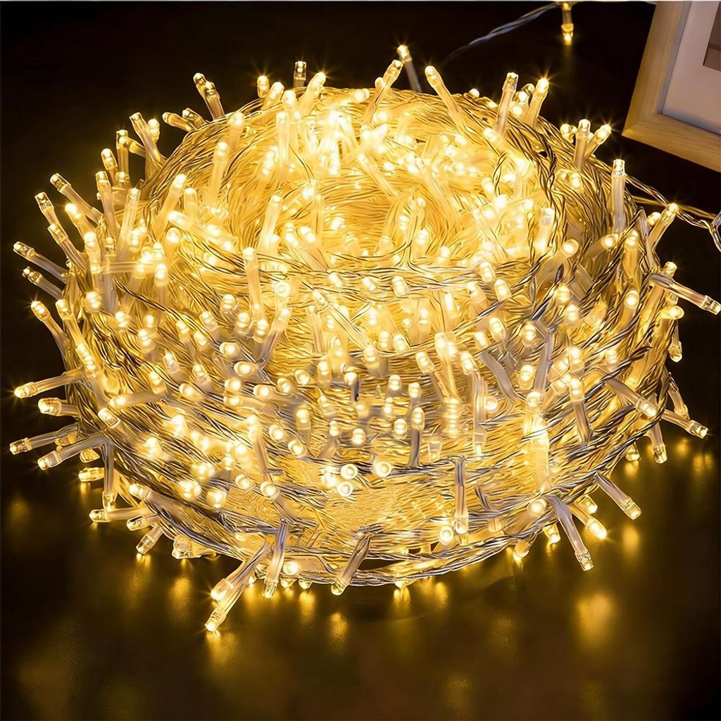 A close-up, coiled bundle of warm white LED string lights.