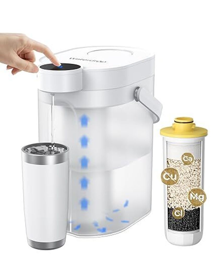 A hand is shown pressing a button on a white electric water filter pitcher, with a cup and a filter cartridge next to it.