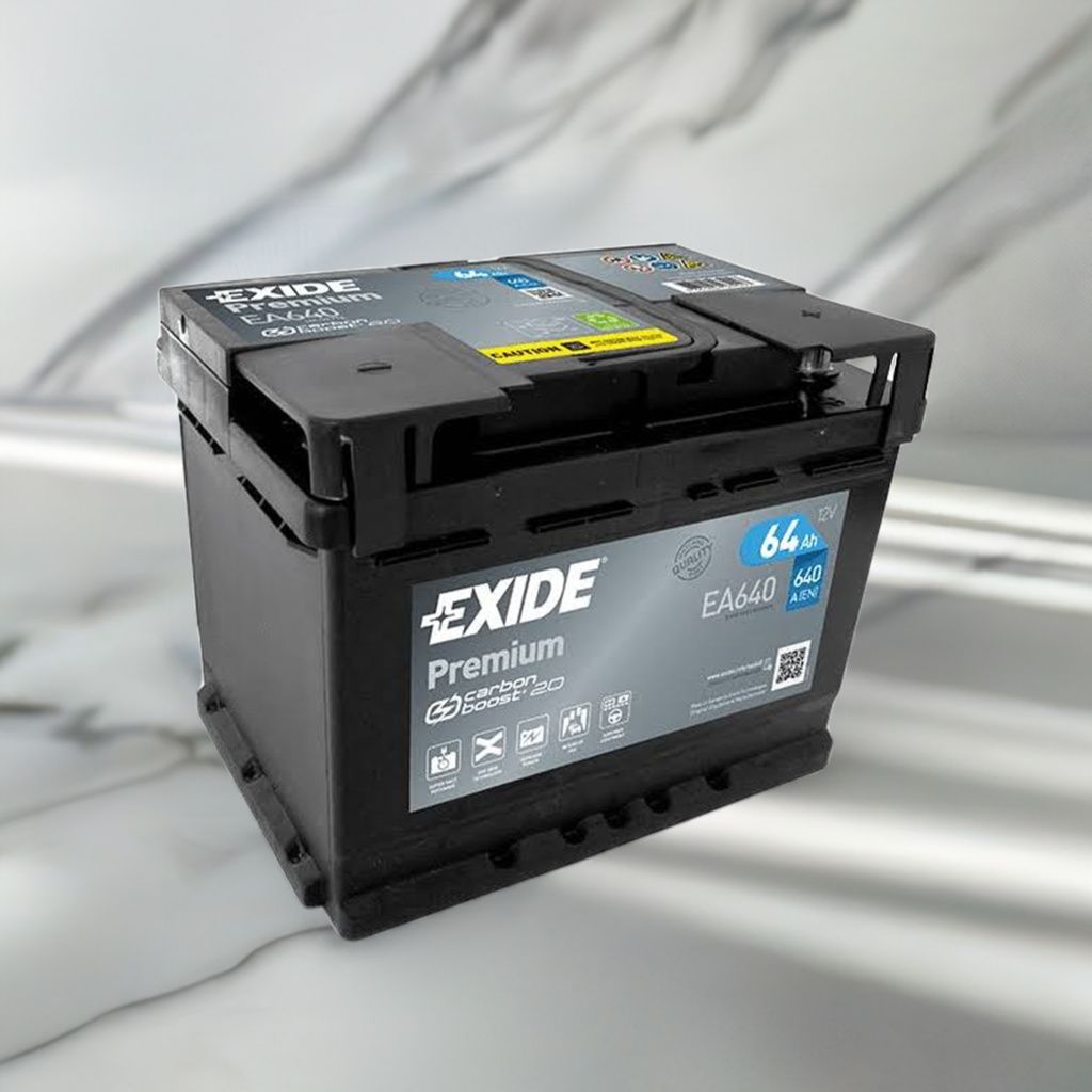 A black EXIDE Premium EA 640 car battery is shown on a reflective, marbled surface with a blurred background.