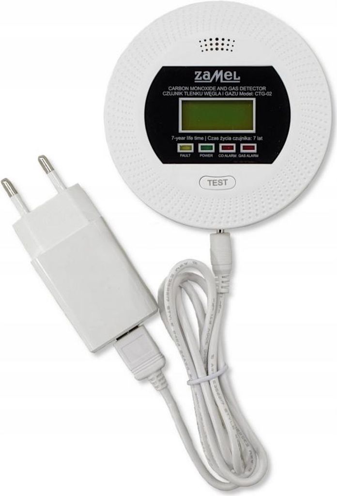 A white carbon monoxide and gas detector with a power adapter and cable, shown on a white background.