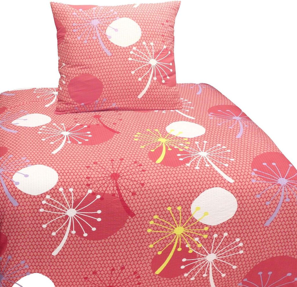 A close-up view of a bedding set with a dandelion pattern.