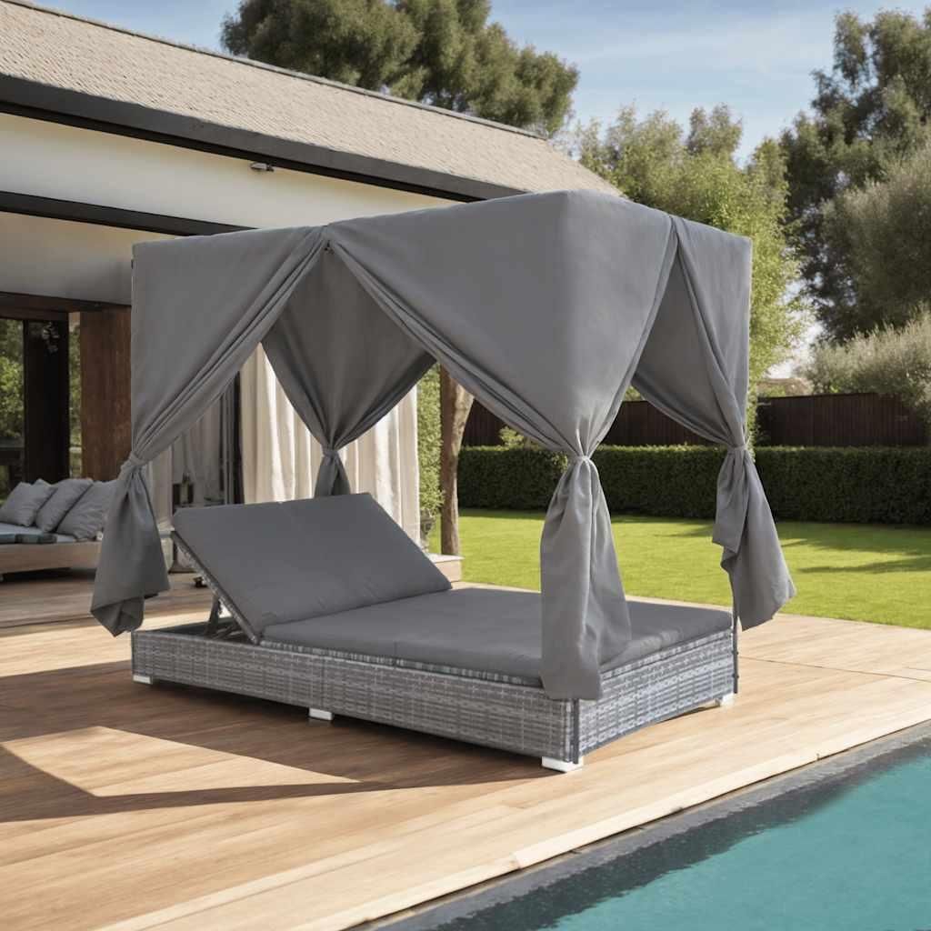 An outdoor lounge bed with curtains next to a swimming pool.