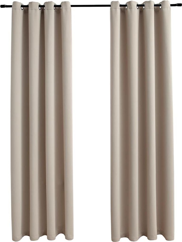 Two beige curtains hanging from a curtain rod.